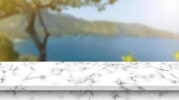 Empty Marble Table with Blurry Nature Background. photo