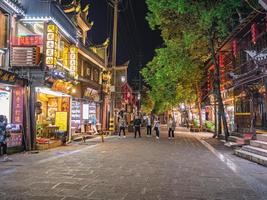 fenghuang,Hunan.China-16 October 2018.Tourist walking in the evening of  fenghuang old town.phoenix ancient town or Fenghuang County is a county of Hunan Province, China photo