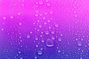 Neon colored water drops background photo