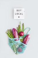 Fresh organic vegetables cotton mesh shopping bag photo