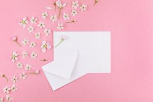 Concept of love letter with envelope and flowers photo