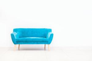 Minimal concept of living interior with blue sofa photo