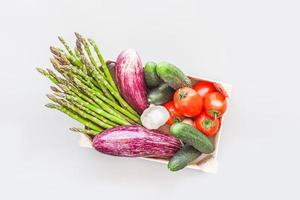 Fresh organic vegetables in wooden box photo