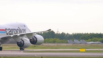NOVOSIBIRSK, RUSSIAN FEDERATION JUNE 10, 2020 - Cargolux Boeing 747 LX VCN taxiing after landing. Tolmachevo Airport, Novosibirsk video