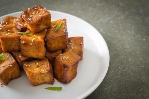 fried tofu with white sesame and teriyaki sauce photo