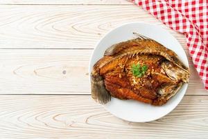 Fried Sea Bass Fish with Garlic photo