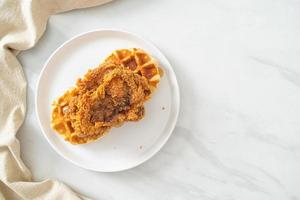 fried chicken waffle with honey or maple syrup photo