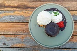 chocolate lava with vanilla ice-cream and whipping cream photo