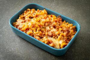 homemade macaroni bolognese with cheese photo