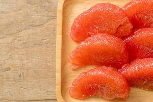 fresh red pomelo fruit or grapefruit photo