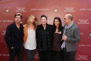 LOS ANGELES, MAR 13 - L-R Actor Patrick Dempsey, wife Jillian Demspey, singer K D Lang, Joyce Varvatos and designer John Varvatos arriving at the John Varvatos 8th Annual Stuart House Benefit at John Varvaots Store on March 13, 2011 in Los Angeles, CA photo