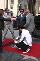 LOS ANGELES, OCT 10 - Usher, Sean Combs, Kenny Babyface Edmonds, Antonio LA Reid at the Kenny Babyface Edmonds Hollywood Walk of Fame Star Ceremony at Hollywood Boulevard on October 10, 2013 in Los Angeles, CA photo