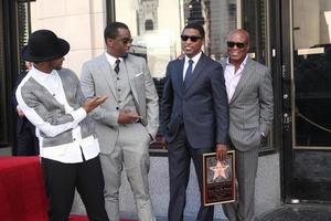 LOS ANGELES, OCT 10 - Usher, Sean Combs, Kenny Babyface Edmonds, Antonio LA Reid at the Kenny Babyface Edmonds Hollywood Walk of Fame Star Ceremony at Hollywood Boulevard on October 10, 2013 in Los Angeles, CA photo