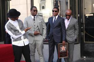 LOS ANGELES, OCT 10 - Usher, Sean Combs, Kenny Babyface Edmonds, Antonio LA Reid at the Kenny Babyface Edmonds Hollywood Walk of Fame Star Ceremony at Hollywood Boulevard on October 10, 2013 in Los Angeles, CA photo