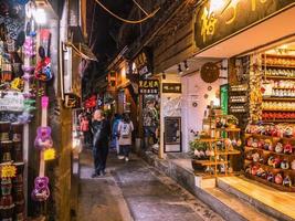 fenghuang,Hunan.China-16 October 2018.Tourist walking in alley building district of Fenghuang ancient town.phoenix ancient town or Fenghuang County is a county of Hunan Province, China photo