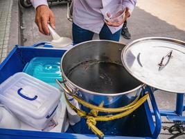 Chaozhou.China-02 April 2018.Unacquainted Chinese people Selling traditional Black Jelly or Grass jelly on the Street at Old town district at chaozhou city Guangdong province China. photo