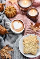Fall flat lay with coffee and autumn decor photo