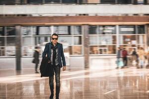 Businessman leaving train station. photo