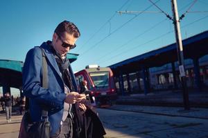 Checking departure at train station. photo