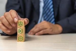 Wood cube block Esg Environmental Social and Governance eco concept of sustainable development of the organization.Investing and management of pollution to reduce global warming. photo