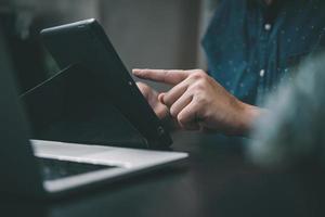 Business using a digital tablet worker touchpad and browsing the internet in an office. photo
