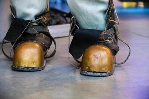 Close-up shoes of an old vintage three-bolt deep-sea diving suit. Suit for deep sea diving of the last century. The history of the study of the underwater world photo