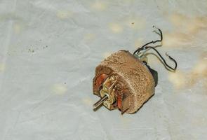 Close-up of a very dirty kitchen exhaust fan. Fan before preventive cleaning and washing. Dirty details photo