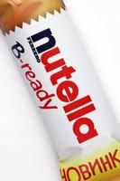KHARKIV, UKRAINE - DECEMBER 16, 2021 Bar of Nutella B-ready crunchy wafer shell filled with creamy Nutella and sprinkled with puffed crisps photo