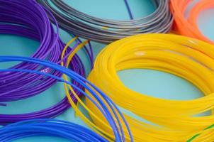 Plastic PLA and ABS filament material for printing on a 3D pen or printer of various colors photo