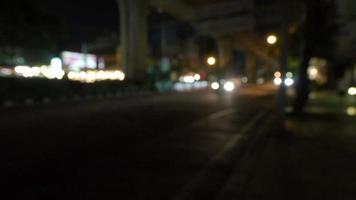 Blurry road scene at night in Bangkok Thailand footage video