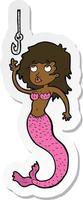 sticker of a cartoon mermaid and fish hook vector