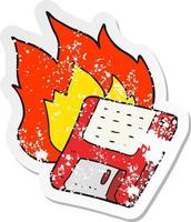 retro distressed sticker of a cartoon old computer disk burning vector