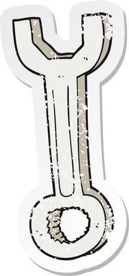 retro distressed sticker of a cartoon spanner