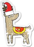 retro distressed sticker of a cartoon reindeer wearing christmas hat vector