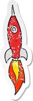 retro distressed sticker of a cartoon rocket vector