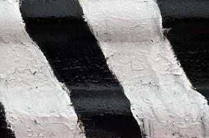 Close-up view of a metal barrier with striped color photo