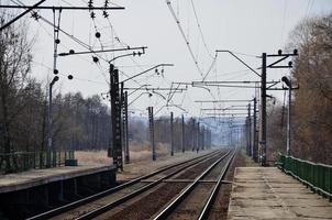 A railway station with platforms for waiting for trains photo