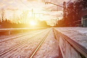 Evening winter landscape with the railway station photo