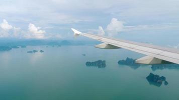 Aerial view over group of island in Andaman sea near Phuket, southern part of Thailand, view from descending airplane video