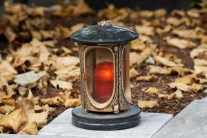 grave lantern in autumn photo
