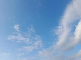 blue sky with puffy clouds background photo