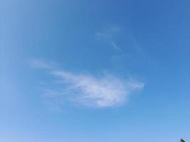 blue sky with puffy clouds background photo