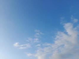 blue sky with puffy clouds background photo