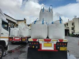 Trailer loading sack goods Chemical fertilizer Urea  to customers. photo