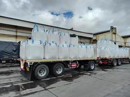 Trailer loading sack goods Chemical fertilizer Urea  to customers. photo