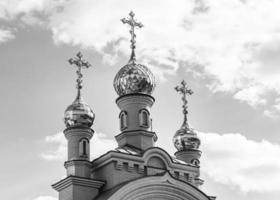 Christian church cross in high steeple tower for prayer photo