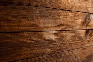 Vintage colored wood background texture with knots and nail holes. Old painted wood wall. Wooden dark horizontal boards. Front view with copy space. photo