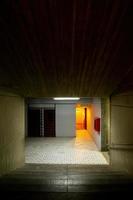 orange light that contrasts with the concrete modern concrete architecture cement building brutalist , stairs of an institution or school, photo