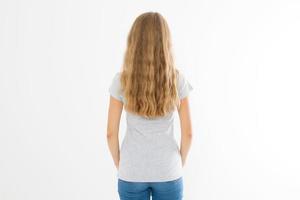 Blonde girl with long and wavy healthy hair isolated on white background. Young woman fashion hairstyle back view. Template and blank copy space. photo