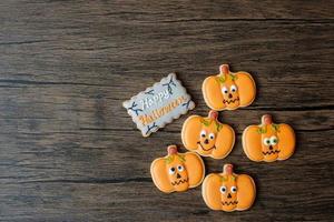 Happy Halloween day with funny Cookies set on wooden table background. Trick or Threat, Hello October, fall autumn, Festive, party and holiday concept photo